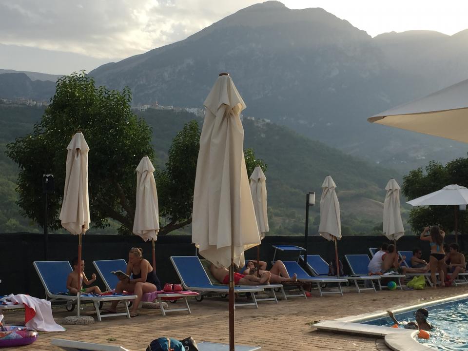 Poolside shot of loungers and parasols